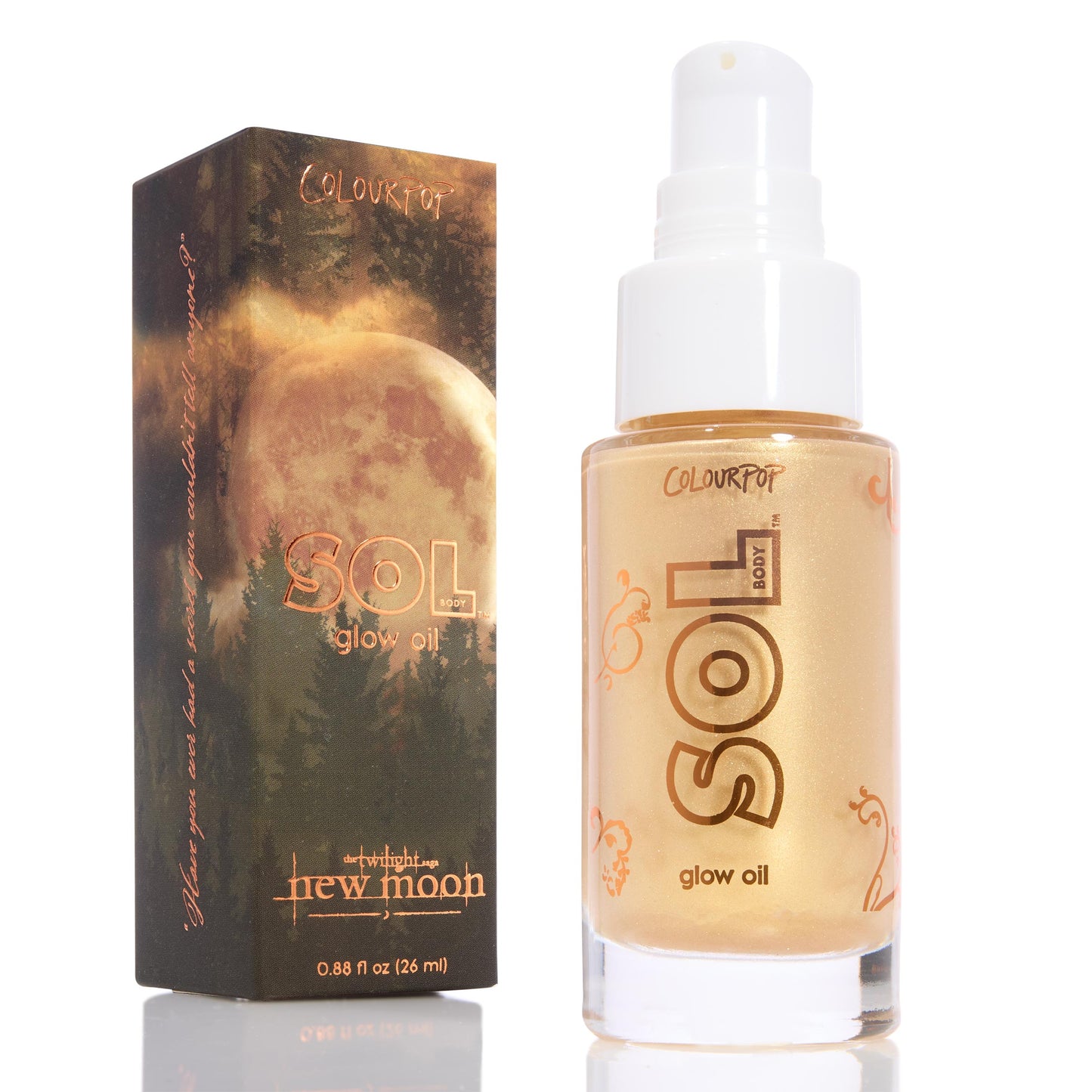 ColourPop SOL Glow Oil ‘It’s a Wolf Thing’ bottle displays golden shimmer and pump, standing beside Twilight New Moon box with full moon and pine forest art; 0.88 fl oz travel size on a white background.